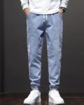 poshax_blue_men_heavily_washed_jogger_jeans.jpg